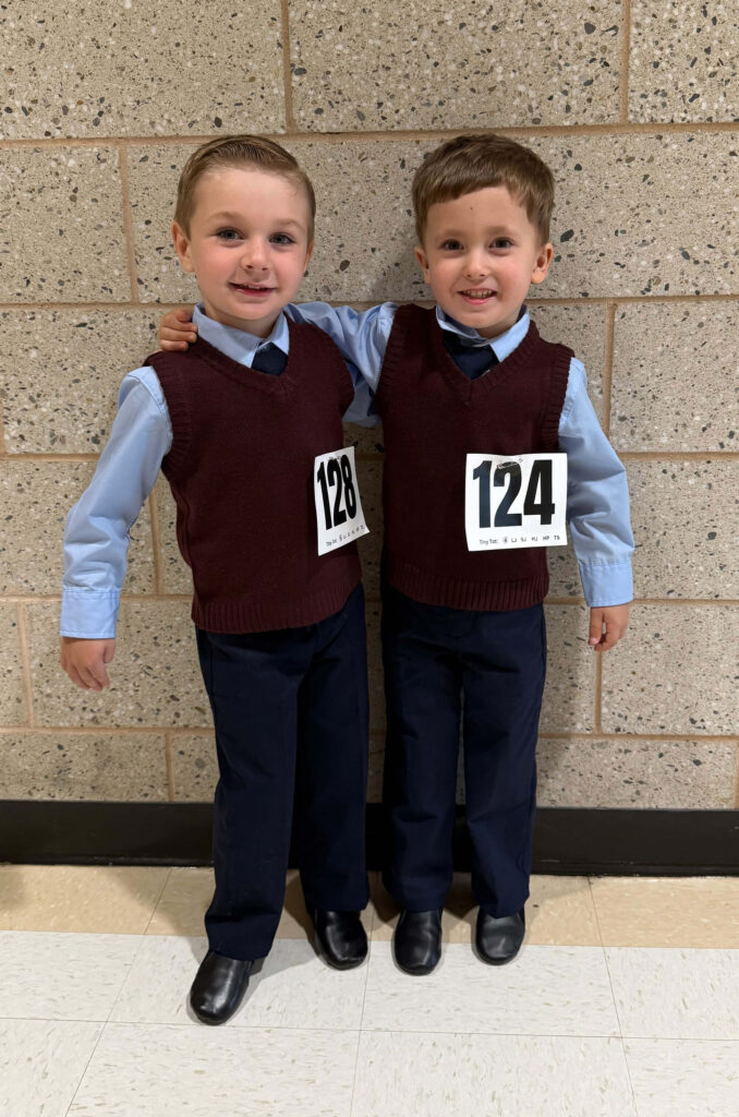 Two Young Male Irish Dancers with Competition Numbers