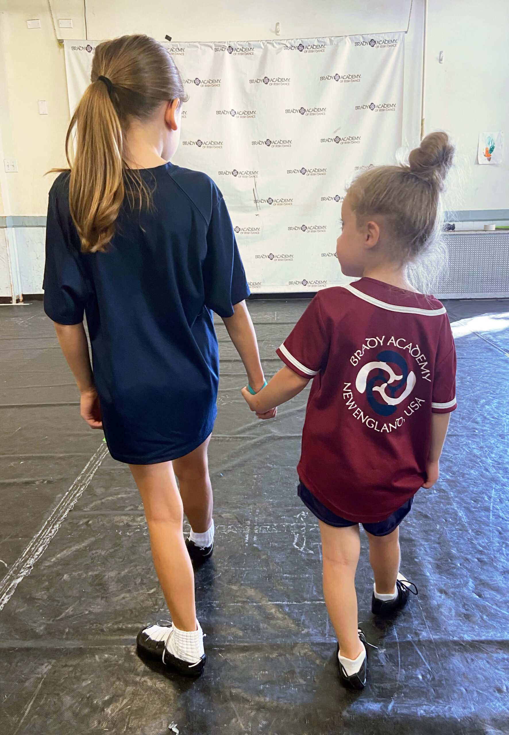 Two Young Irish Dancers Holding Hands